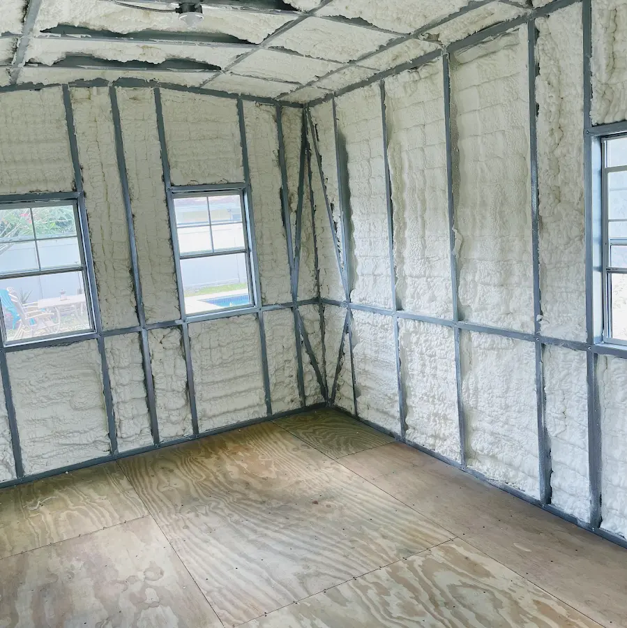 Closed-cell spray foam insulation applied to wall cavities in a residential project in West Pleasant View